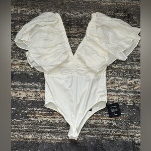 Elegant White Ruffled Bodysuit